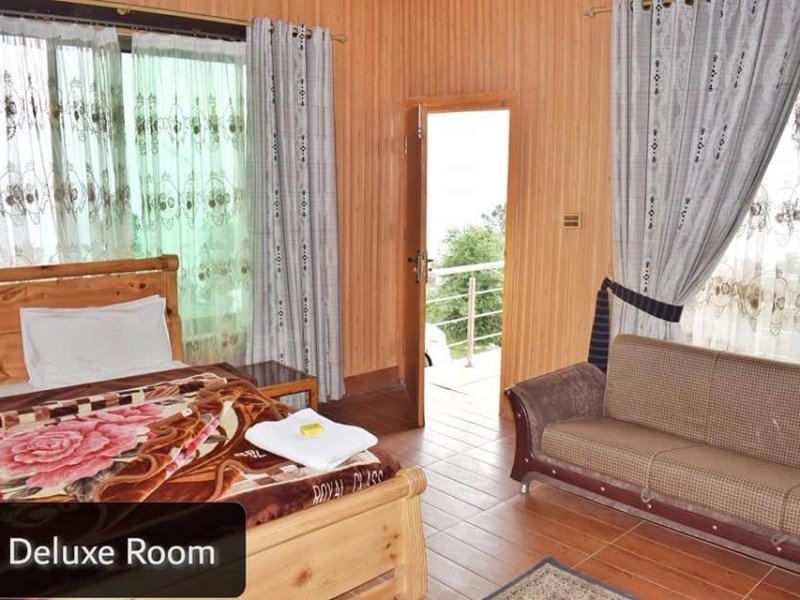 Taj Mahal Hotel & Restaurant Elysium Lodges Shogran Deluxe Room Sofa